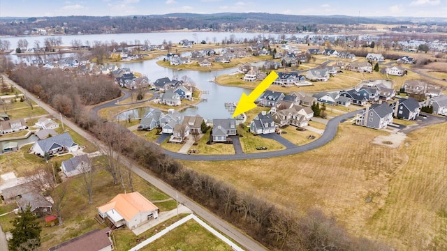 bird's eye view featuring a water view and a residential view