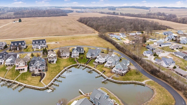 birds eye view of property featuring a water view and a residential view