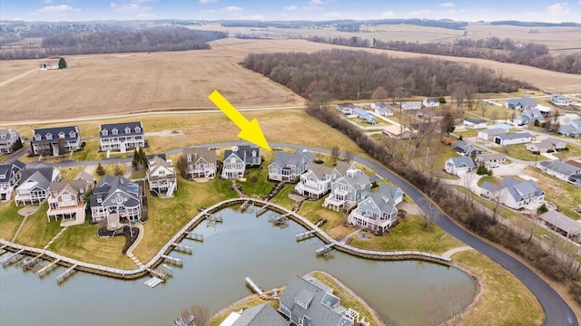 aerial view featuring a residential view and a water view