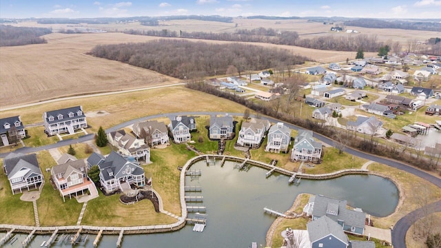 birds eye view of property featuring a residential view, a water view, and a rural view