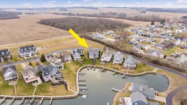 bird's eye view featuring a residential view and a water view