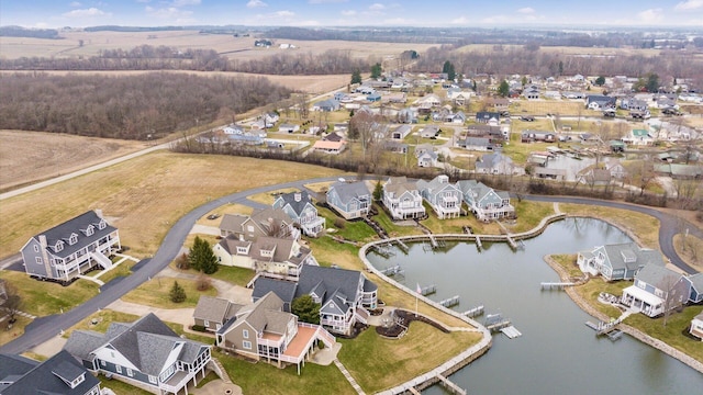 drone / aerial view featuring a water view and a residential view