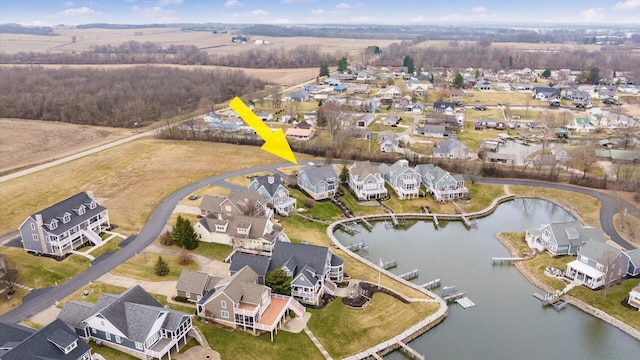 bird's eye view with a residential view and a water view