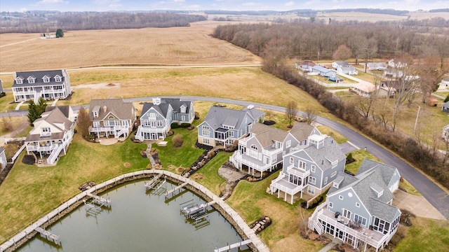 birds eye view of property with a water view and a residential view