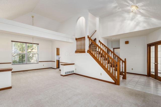 living room featuring carpet flooring, visible vents, and baseboards