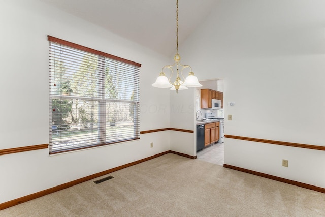 unfurnished room with light colored carpet, a sink, visible vents, a healthy amount of sunlight, and an inviting chandelier