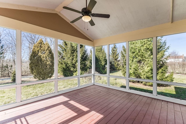 unfurnished sunroom featuring lofted ceiling and ceiling fan