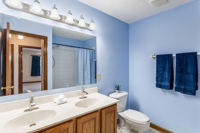 bathroom with visible vents, a sink, a textured ceiling, and toilet