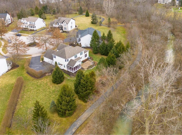 birds eye view of property with a residential view