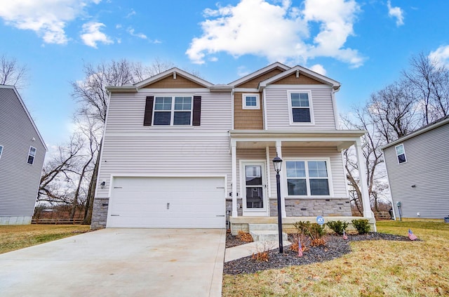 craftsman-style house with a porch, an attached garage, a front yard, stone siding, and driveway