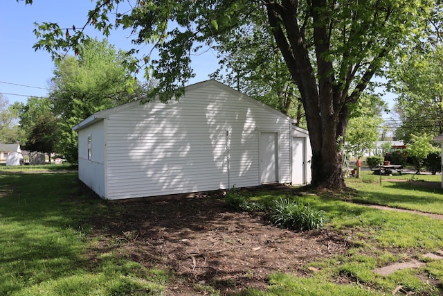 view of side of home featuring a yard