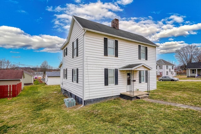 view of front of house featuring central AC unit, a chimney, a front yard, and fence