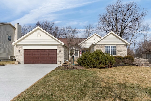 ranch-style house featuring an attached garage, stone siding, concrete driveway, and a front yard