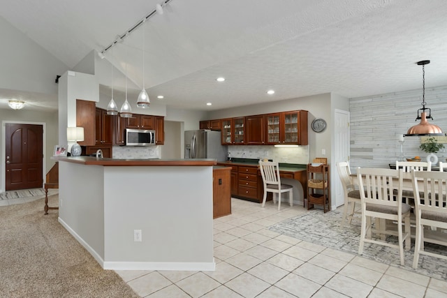 kitchen with stainless steel appliances, light tile patterned flooring, glass insert cabinets, and tasteful backsplash