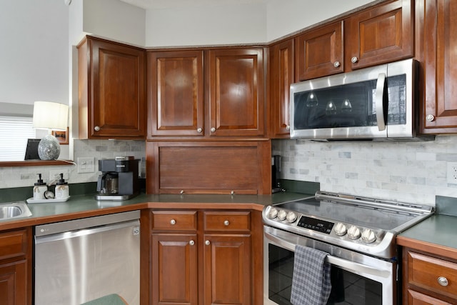 kitchen with a sink, appliances with stainless steel finishes, backsplash, and brown cabinets