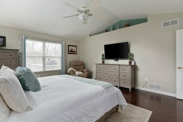 bedroom with baseboards, vaulted ceiling, visible vents, and dark wood finished floors