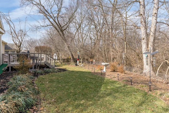 view of yard with a wooden deck