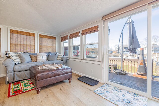 127 Brads Way, Russells Point, OH 43348 - living area with a textured ceiling, baseboards, and wood finished floors