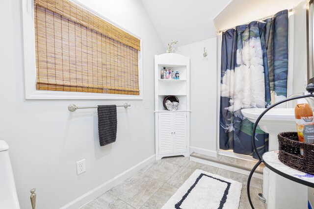 127 Brads Way, Russells Point, OH 43348 - bathroom with vaulted ceiling and baseboards