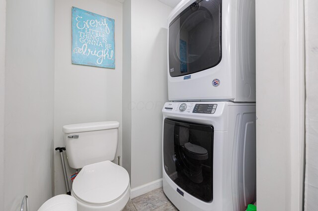127 Brads Way, Russells Point, OH 43348 - interior space featuring stacked washer and clothes dryer, baseboards, and laundry area
