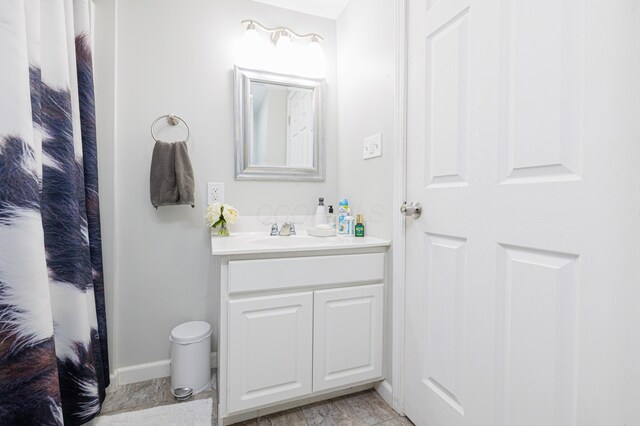 127 Brads Way, Russells Point, OH 43348 - bathroom featuring vanity and baseboards