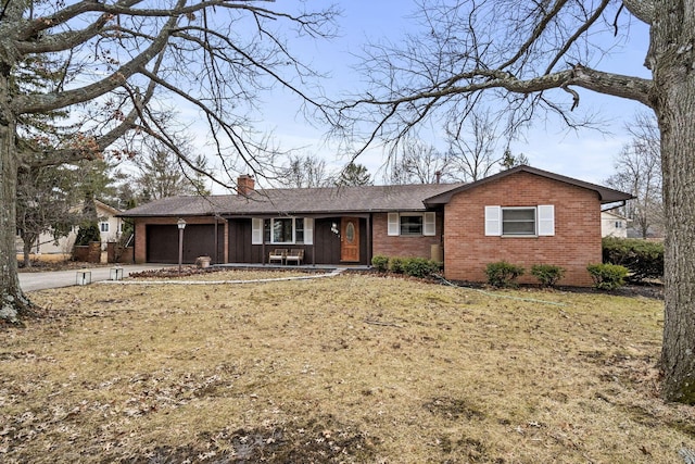 single story home featuring a garage, driveway, a chimney, and brick siding