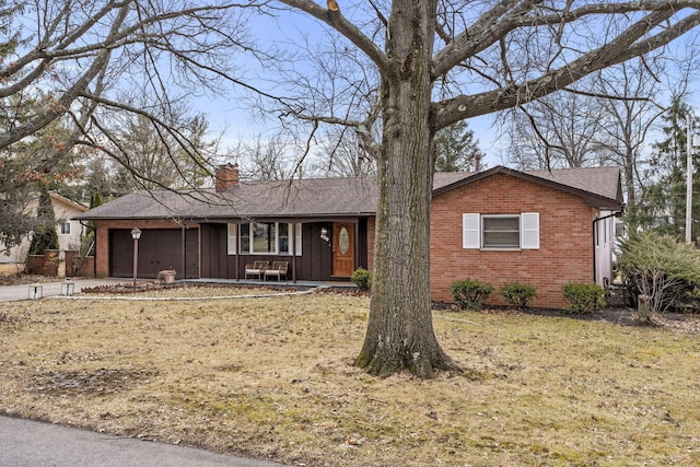 single story home with a porch, an attached garage, brick siding, board and batten siding, and a chimney