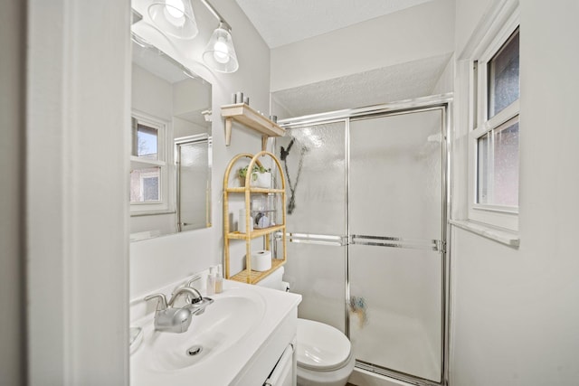 full bath with toilet, a shower stall, and vanity