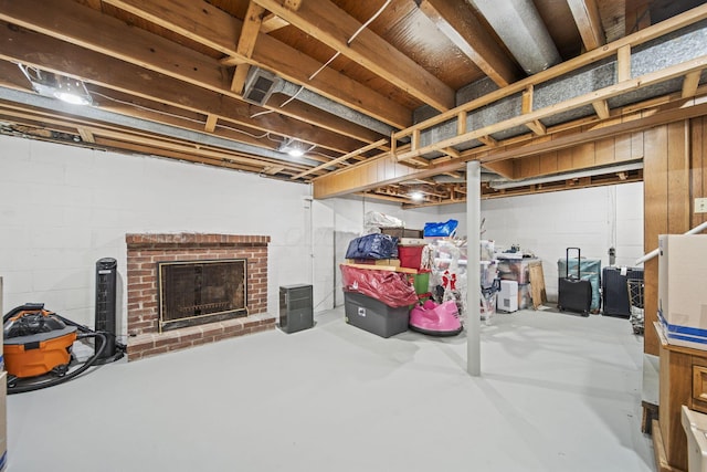 unfinished basement with a fireplace