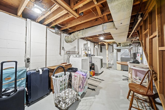 unfinished below grade area featuring independent washer and dryer