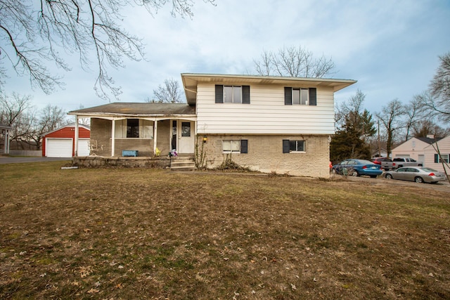 view of front of house featuring a garage, covered porch, brick siding, and a front lawn