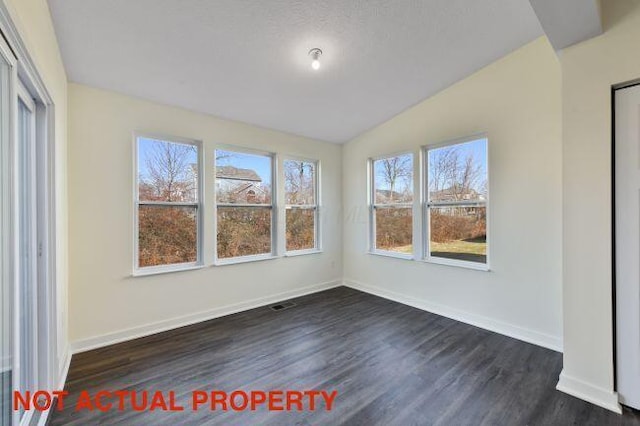 unfurnished sunroom with lofted ceiling