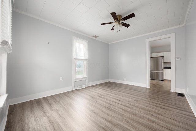 409 High St, Utica, OH 43080 - spare room featuring crown molding, wood finished floors, and ceiling fan
