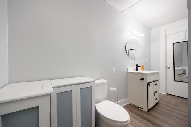 409 High St, Utica, OH 43080 - bathroom featuring vanity and wood finished floors
