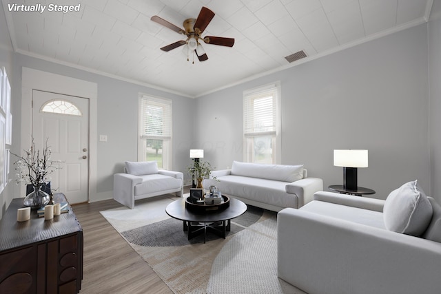 409 High St, Utica, OH 43080 - living area featuring crown molding, plenty of natural light, light wood-style floors, and ceiling fan