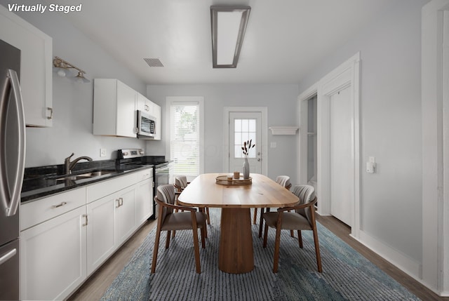 409 High St, Utica, OH 43080 - dining room featuring dark wood finished floors and baseboards