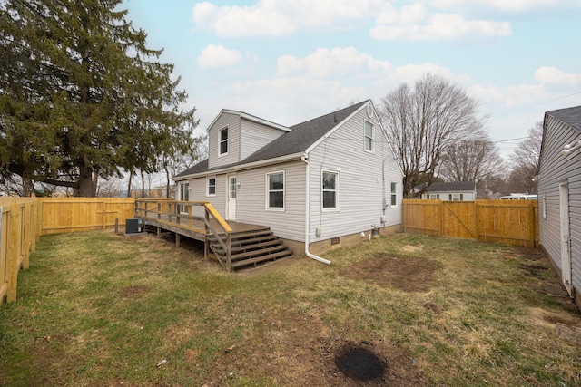 rear view of property featuring a yard, central AC unit, a fenced backyard, and a wooden deck