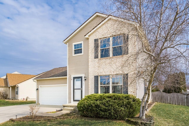 traditional-style home featuring a garage, concrete driveway, fence, a front lawn, and brick siding