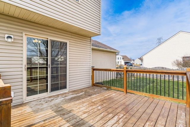 deck featuring fence and a lawn