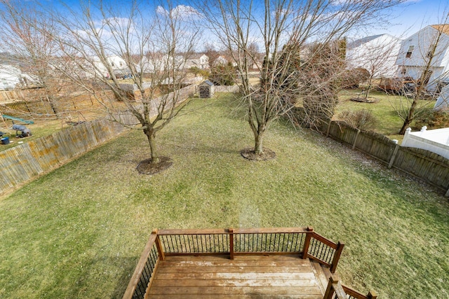 view of yard featuring a fenced backyard and a wooden deck