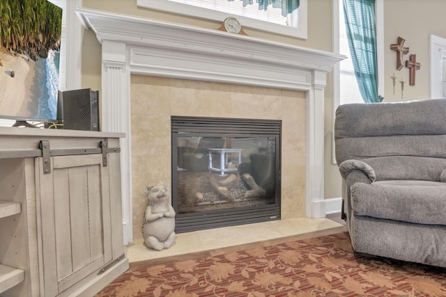 room details featuring a tiled fireplace