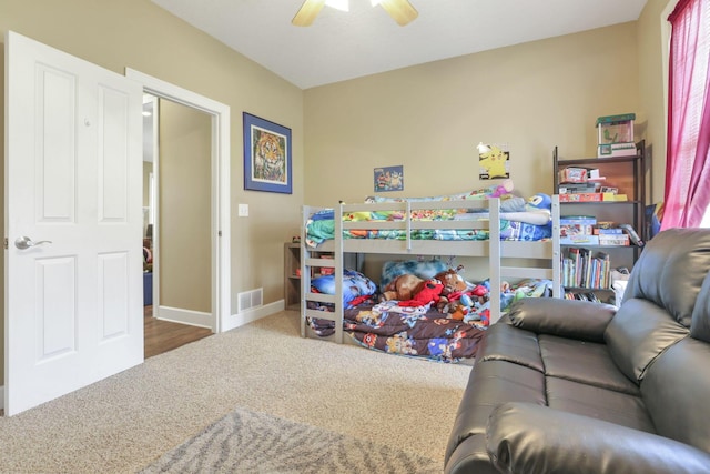 bedroom with carpet floors, visible vents, baseboards, and a ceiling fan