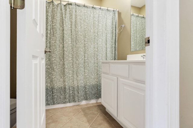 full bath featuring tile patterned flooring, vanity, and a shower with shower curtain