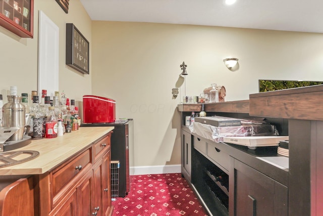 interior space with glass insert cabinets and baseboards