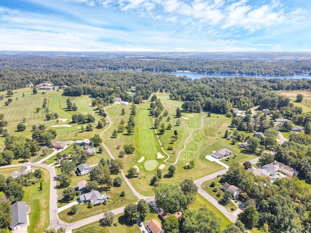 drone / aerial view with a water view and a wooded view