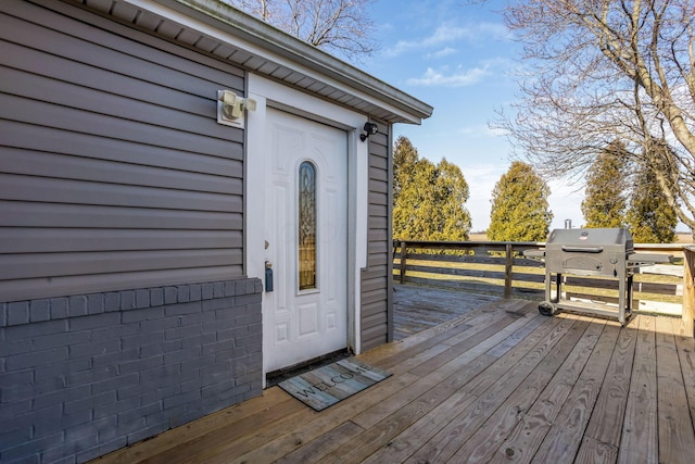 property entrance with a wooden deck