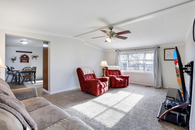 living room with carpet floors, lofted ceiling, ceiling fan, and baseboards