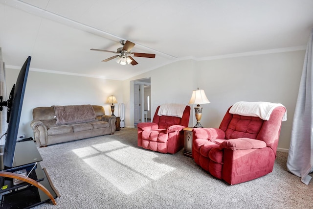 carpeted living area featuring vaulted ceiling, ceiling fan, and crown molding