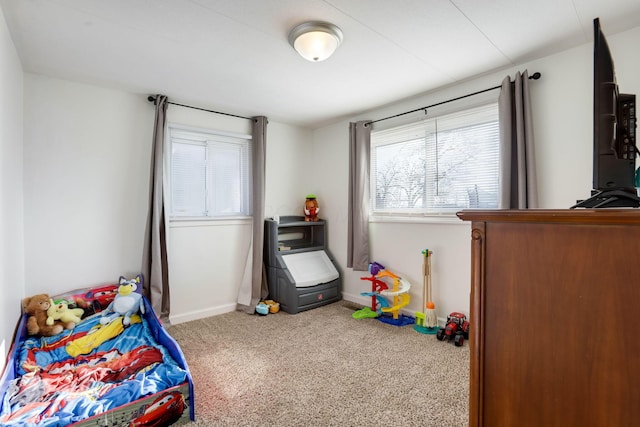 carpeted bedroom with baseboards