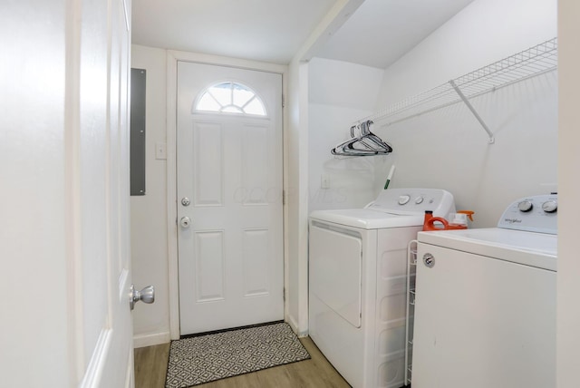 laundry area featuring light wood-style floors, laundry area, and independent washer and dryer